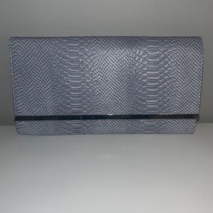 Atmosphere grey snake embossed faux leather clutch with silver hardware.